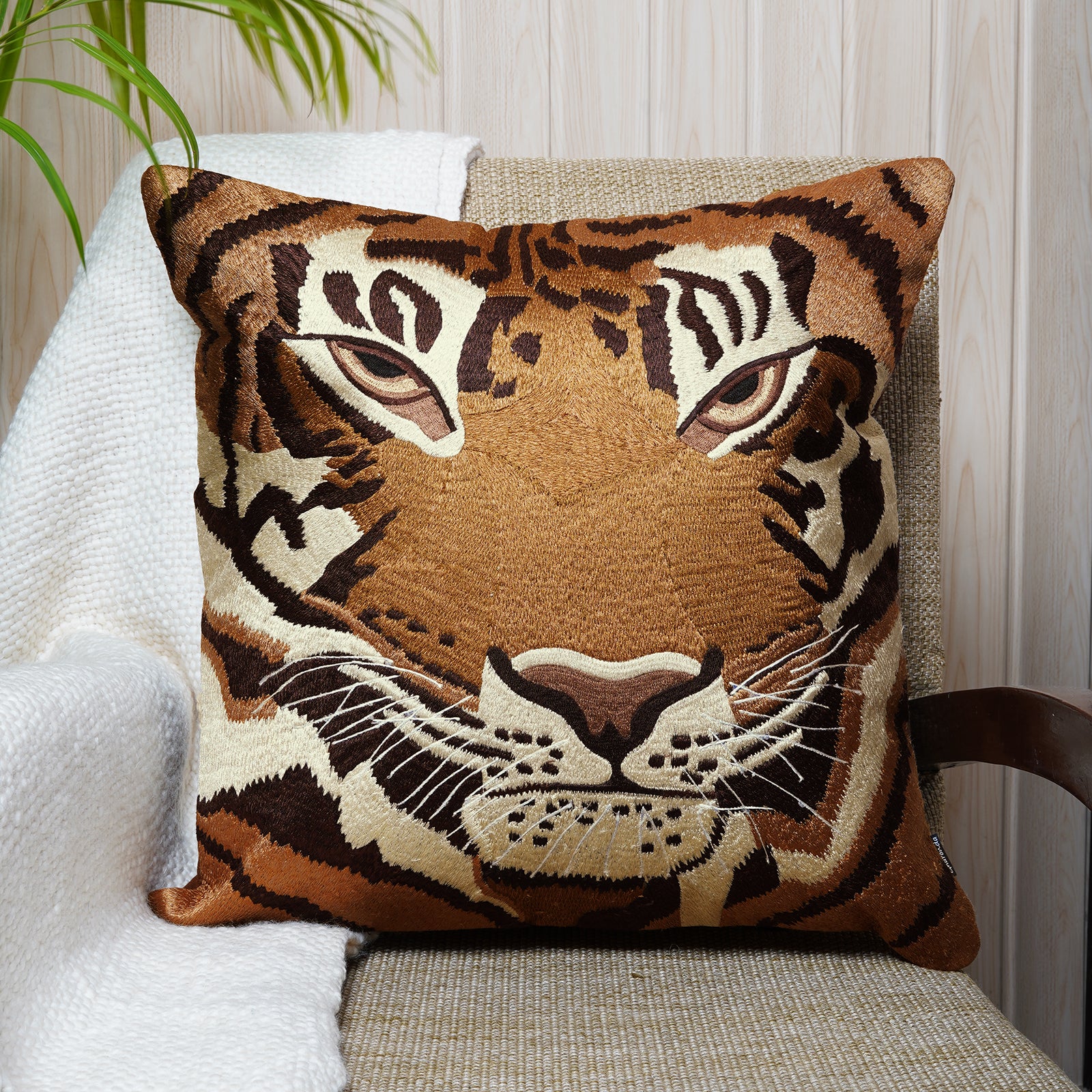 Square cotton cushion with bold tiger face embroidery in warm earthy tones - Dash & Twine Beauty and the Beasts Collection